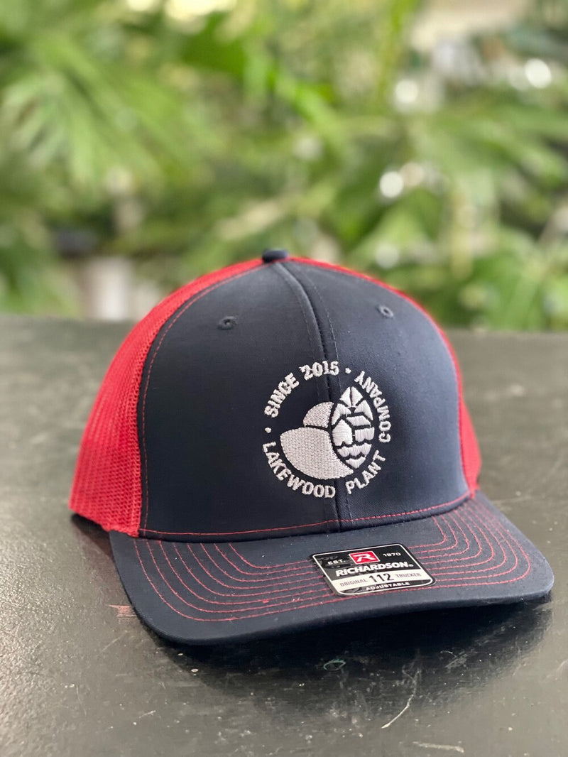 Embroidered White Logo Trucker Hat